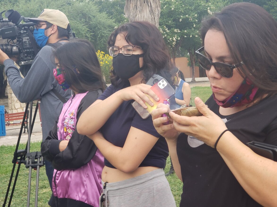 Three indigenous women stood at a safe distance to watch. They burned sage, they explained, to cleanse the area. They called for a period of healing in the community.